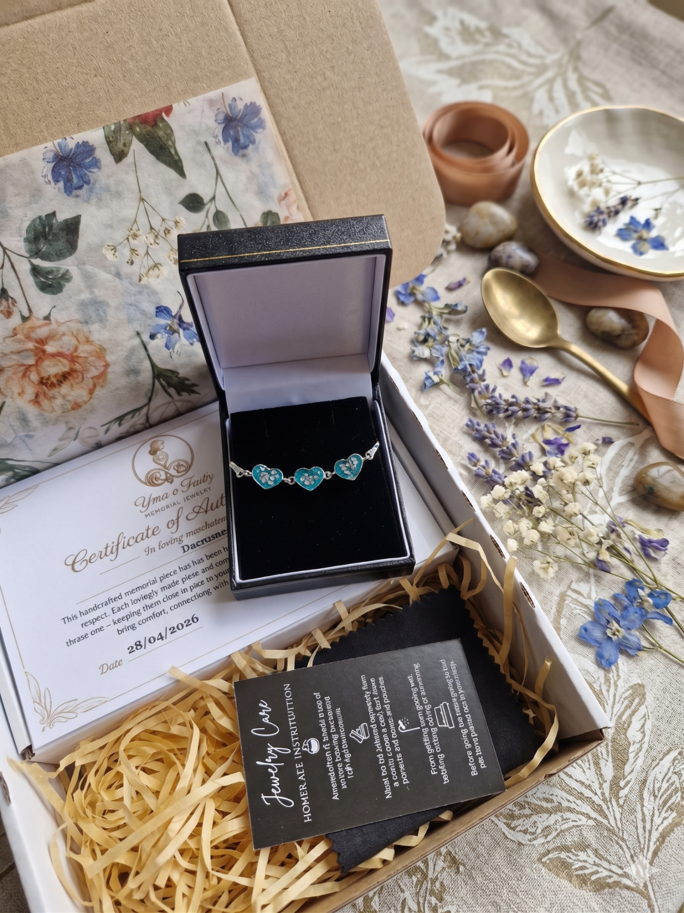 A jewellery box containing a turquoise bracelet with decorative elements around it.