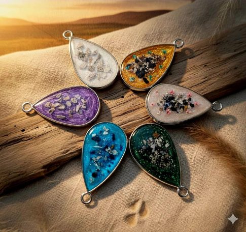 Colourful teardrop-shaped pendants featuring various decorative elements.